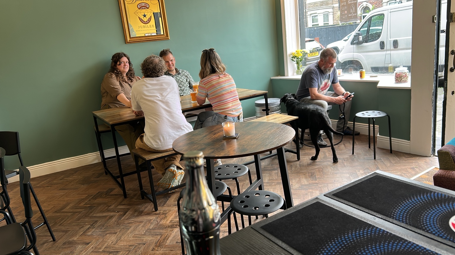Friends connecting over drinks at The Living Room in Whitley Bay