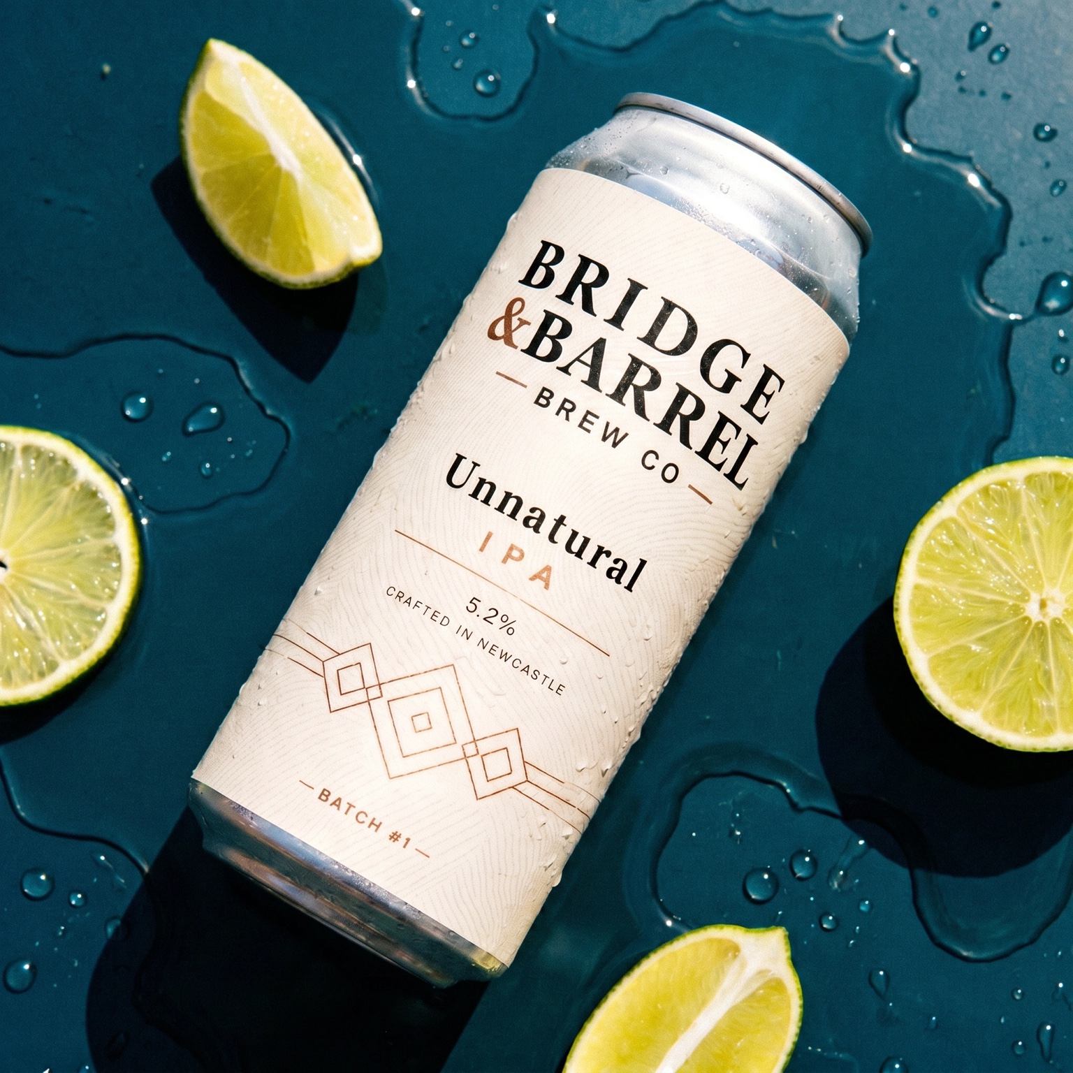 Cold can of Unnatural IPA with fresh lime
